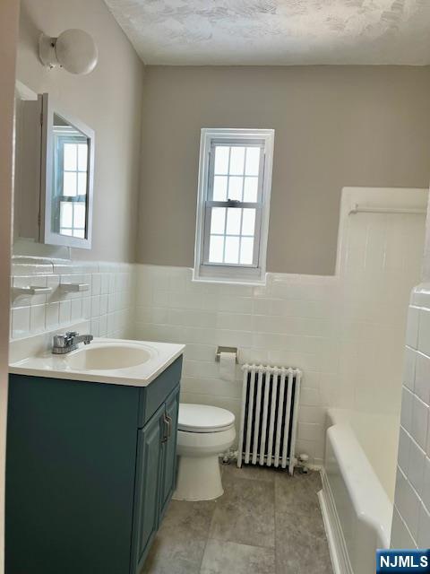 285 Teaneck Road, Unit 285B Ridgefield Park, NJ 07660 - Photo 6 of 12 a bathroom with a sink toilet and mirror