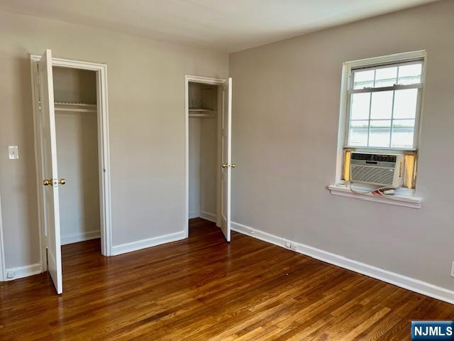 285 Teaneck Road, Unit 285B Ridgefield Park, NJ 07660 - Photo 9 of 12 an empty room with wooden floor closet and windows