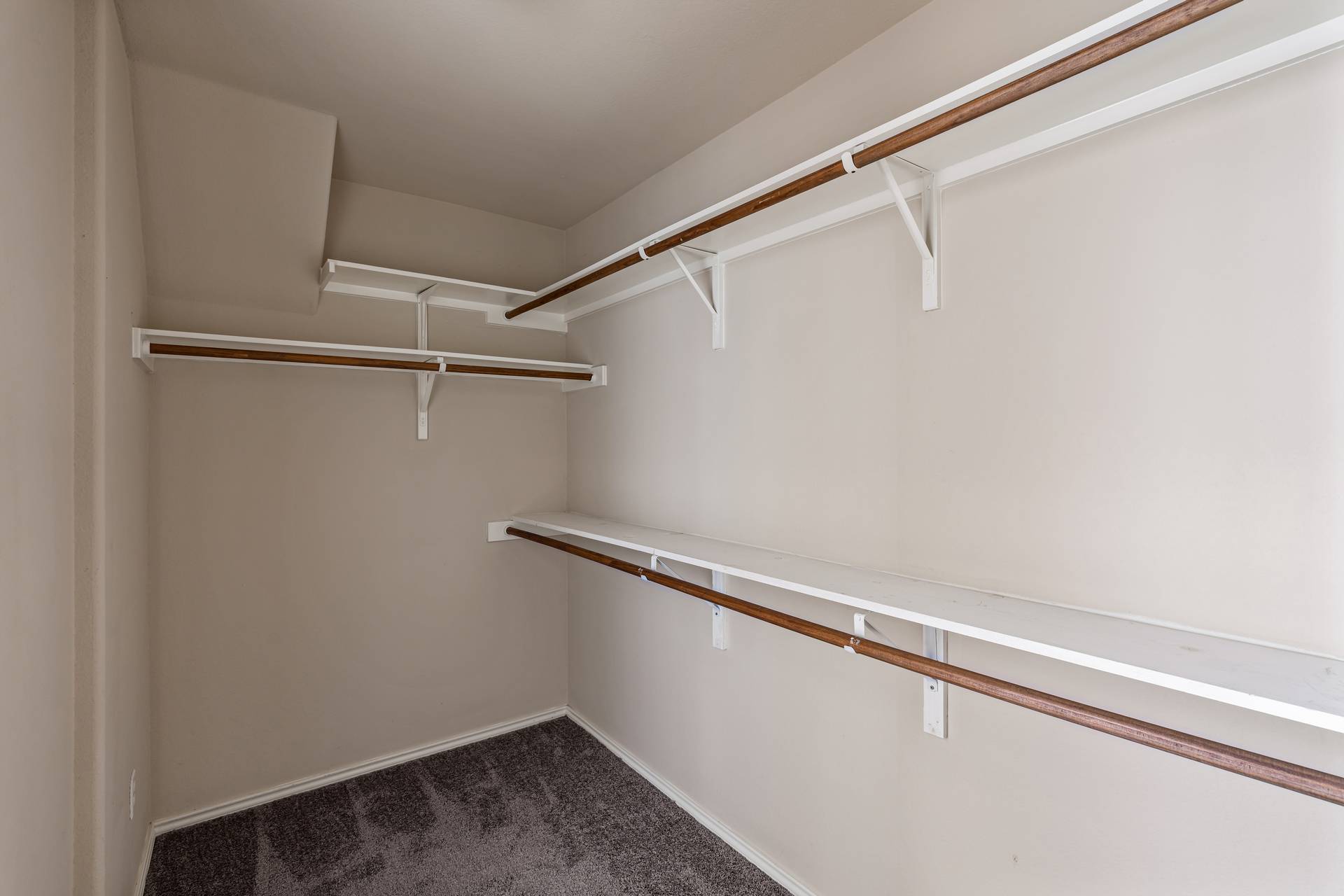 180 Fletcher Bend Buda, TX 78610 - Photo 20 of 36 a view of a room with racks on the wall