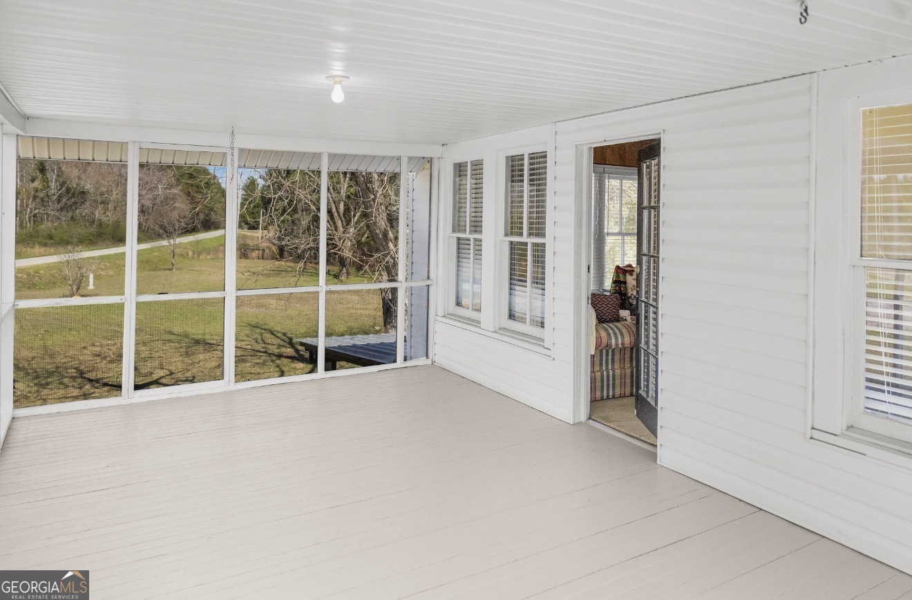 17332 Old River Road North Statesboro, GA 30461 - Photo 3 of 26 a view of an empty room with a window