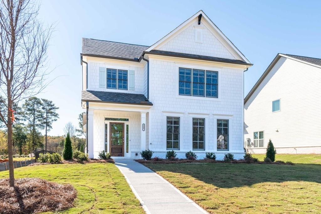 3253 Rockbridge Road Southwest Avondale Estates, GA 30002 - Photo 1 of 1 a front view of a house with a yard