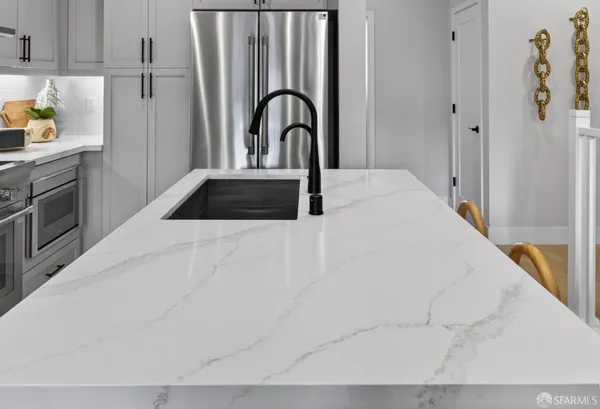 a bedroom with a bed and a sink