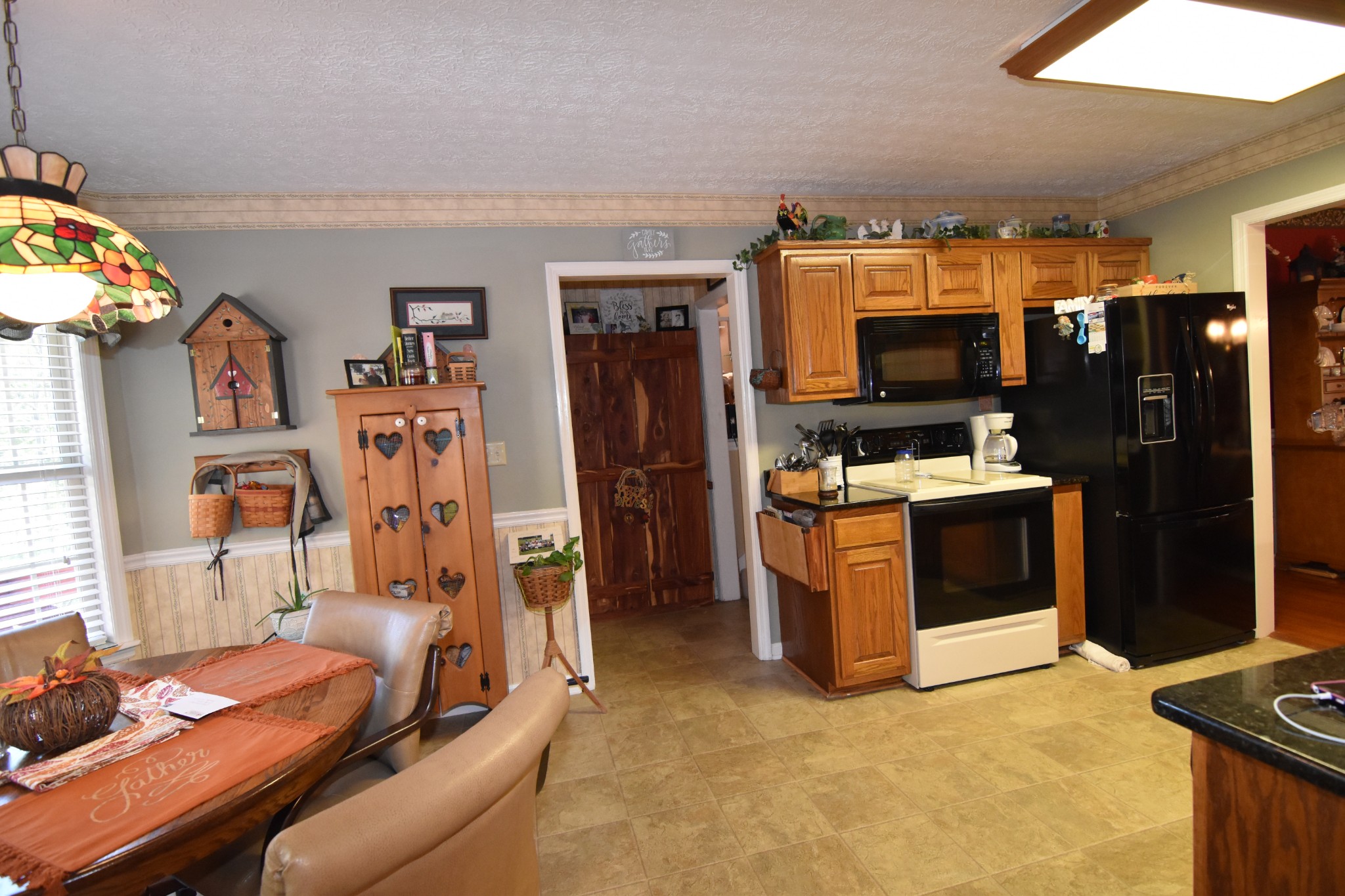 980 Harkreader Road Mount Juliet, TN 37122 - Photo 13 of 33 a view of living room filled with furniture and a flat screen tv
