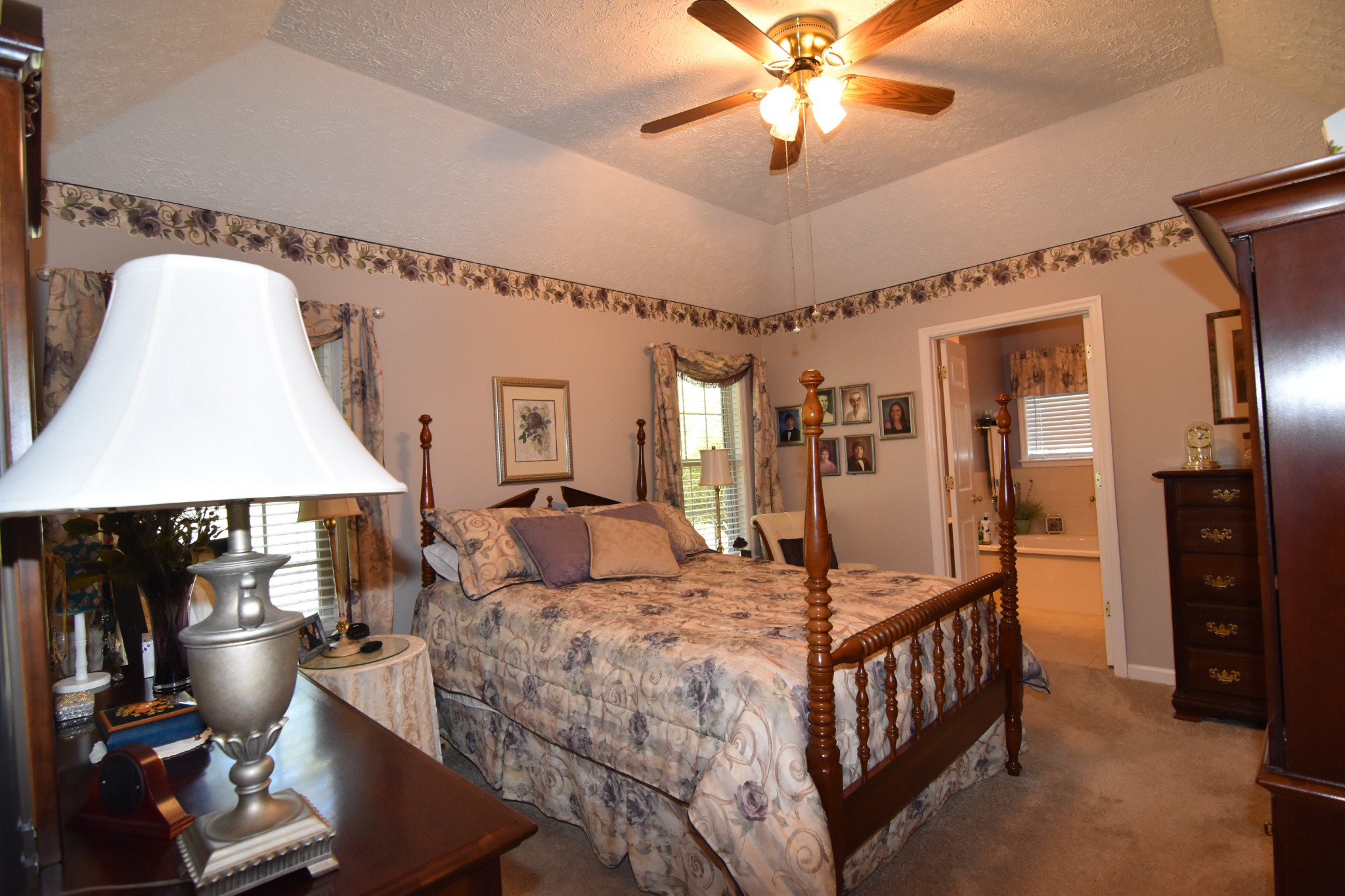 980 Harkreader Road Mount Juliet, TN 37122 - Photo 14 of 33 a bedroom with a bed and a chandelier
