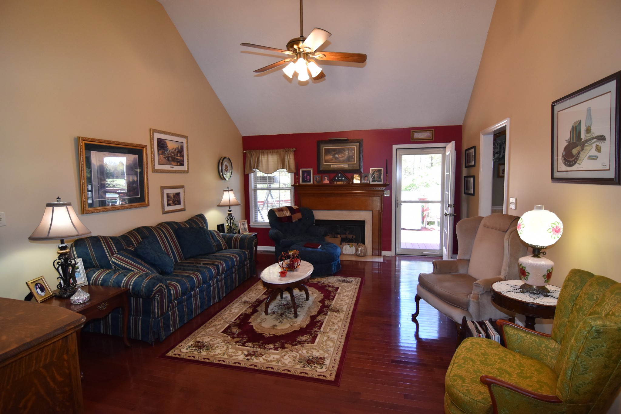 980 Harkreader Road Mount Juliet, TN 37122 - Photo 5 of 33 a living room with furniture a lamp and a fireplace
