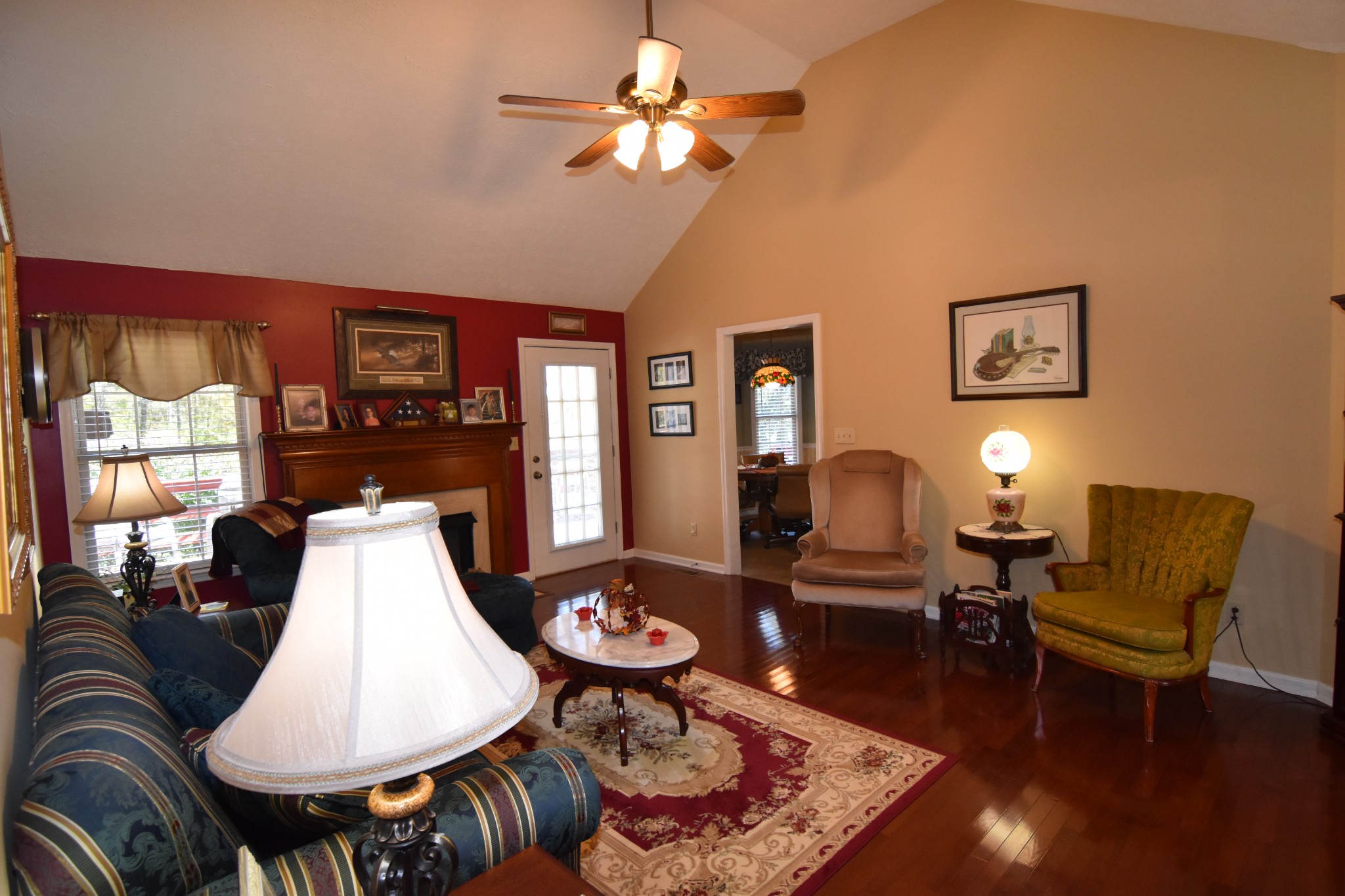 980 Harkreader Road Mount Juliet, TN 37122 - Photo 6 of 33 a living room with furniture a lamp and a chandelier