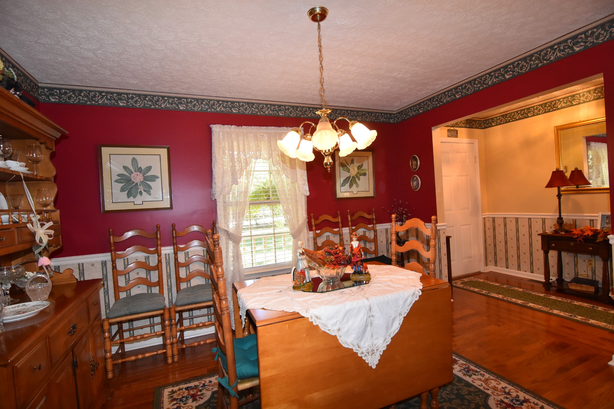980 Harkreader Road Mount Juliet, TN 37122 - Photo 10 of 33 a view of a dining room with furniture a chandelier and large windows