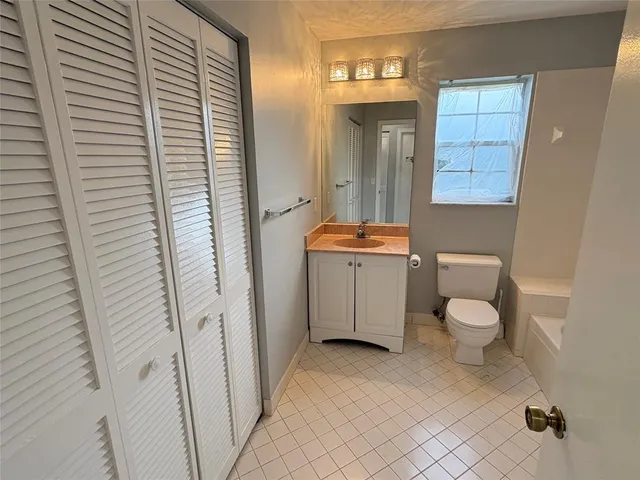 a view of wooden floor and windows in a room