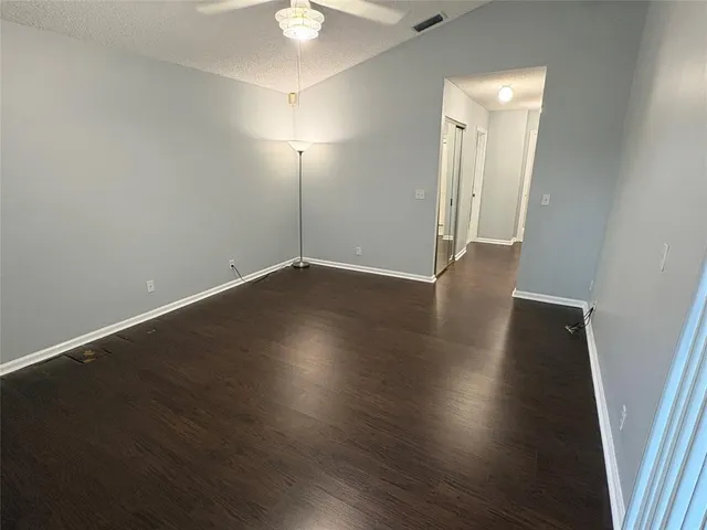 a view of walk in closet with wooden floor