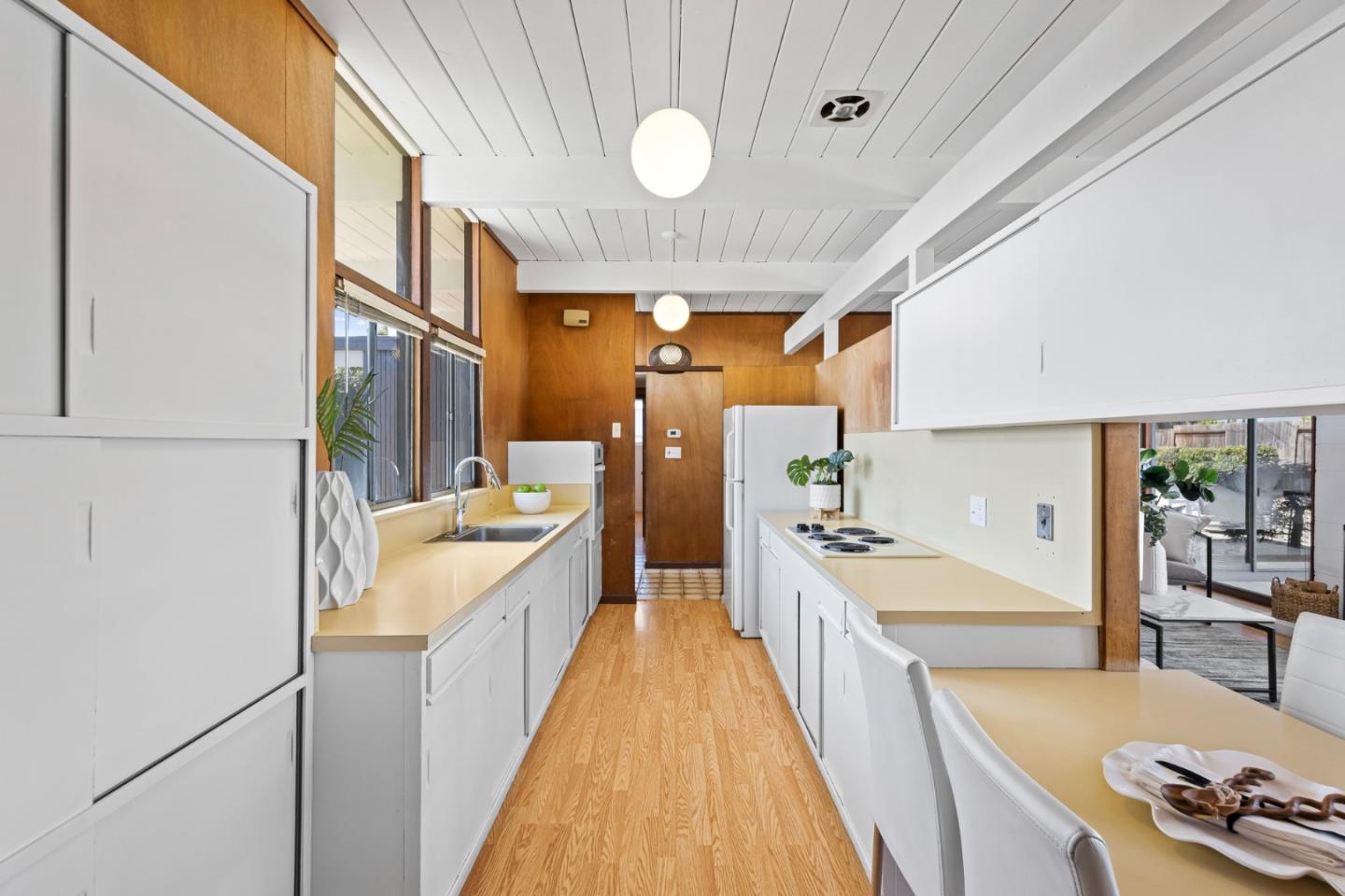 653 Edna Way San Mateo, CA 94402 - Photo 13 of 41 a large white kitchen with a large window