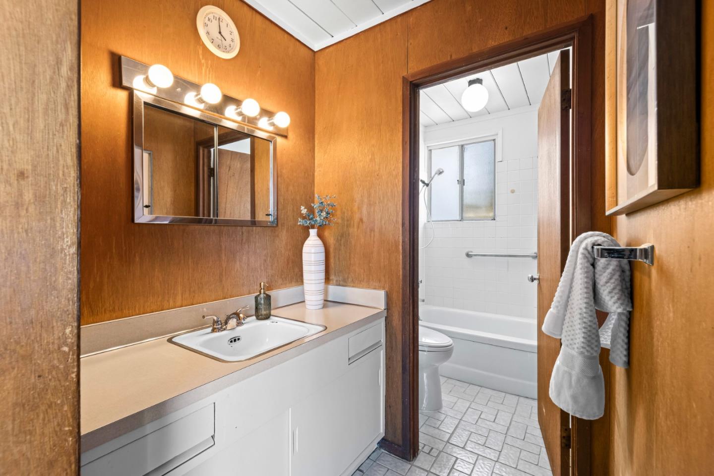 653 Edna Way San Mateo, CA 94402 - Photo 18 of 41 a bathroom with a sink vanity and a mirror