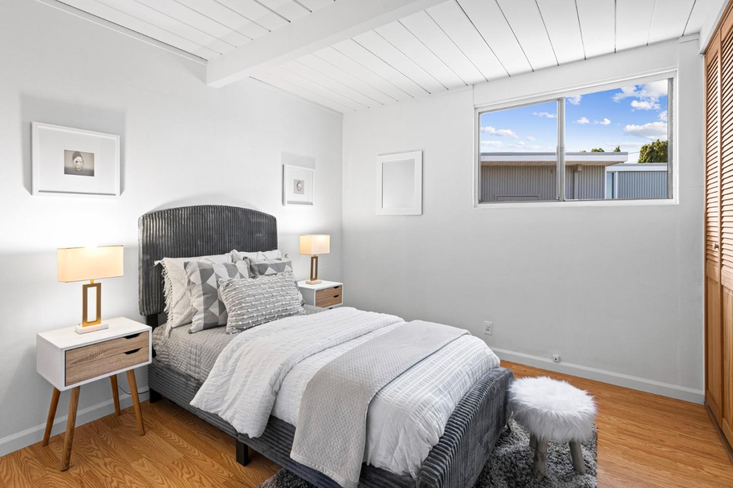653 Edna Way San Mateo, CA 94402 - Photo 19 of 41 a bedroom with a bed and wooden floor