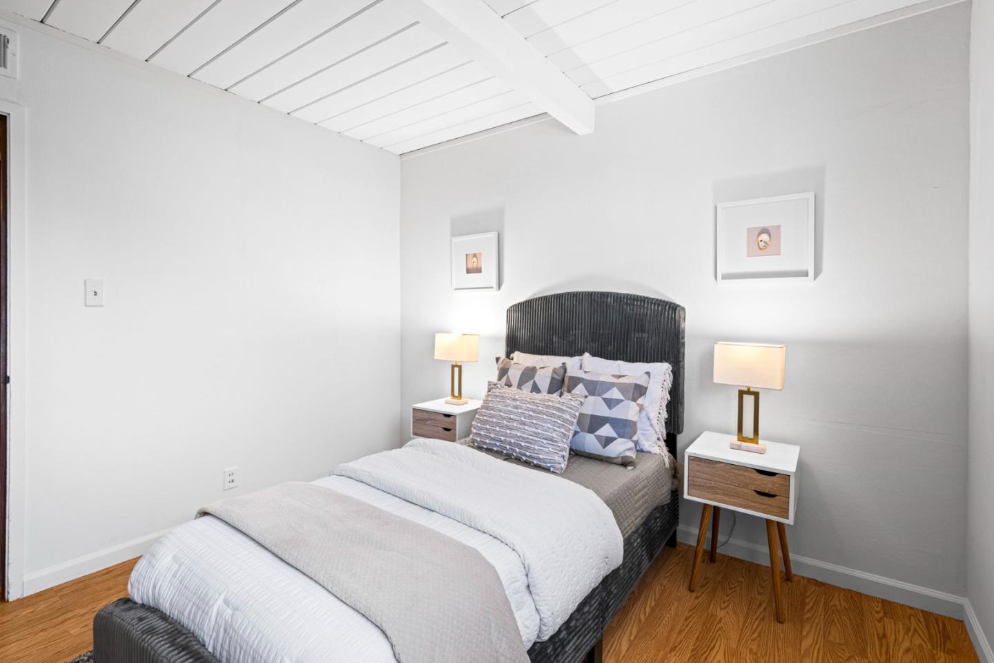 653 Edna Way San Mateo, CA 94402 - Photo 20 of 41 a bedroom with a bed and a lamp