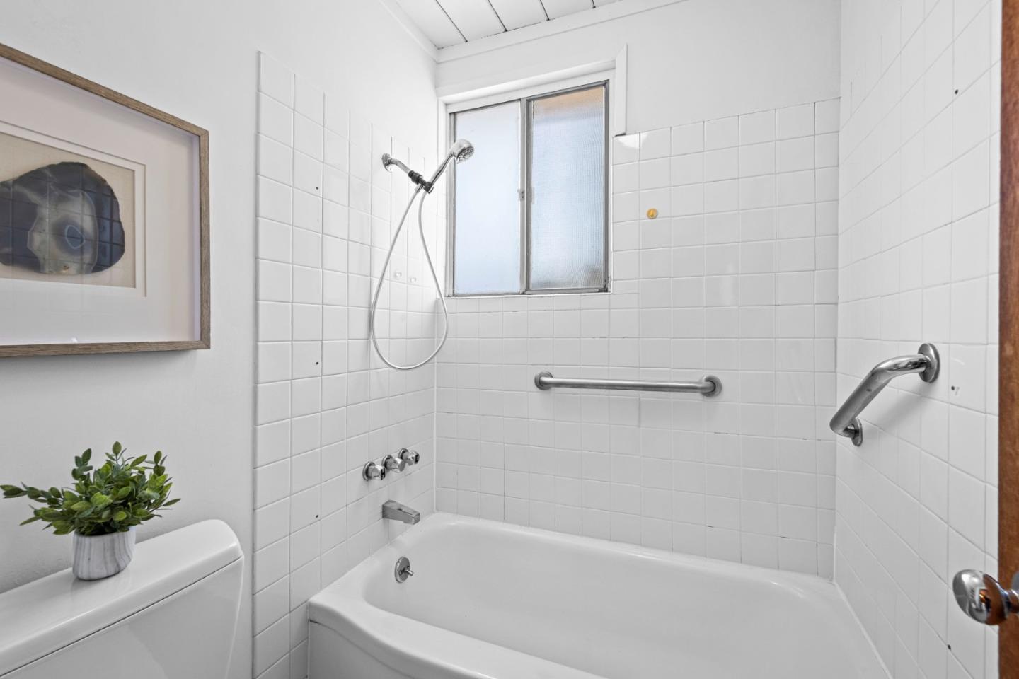 653 Edna Way San Mateo, CA 94402 - Photo 21 of 41 a bathroom with a tub shower and a sink