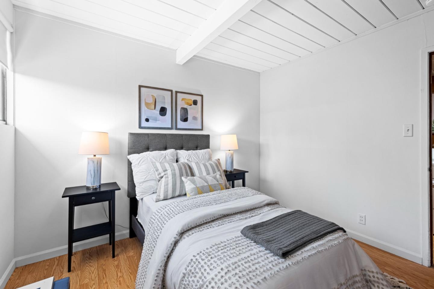 653 Edna Way San Mateo, CA 94402 - Photo 23 of 41 a bedroom with a bed and a table