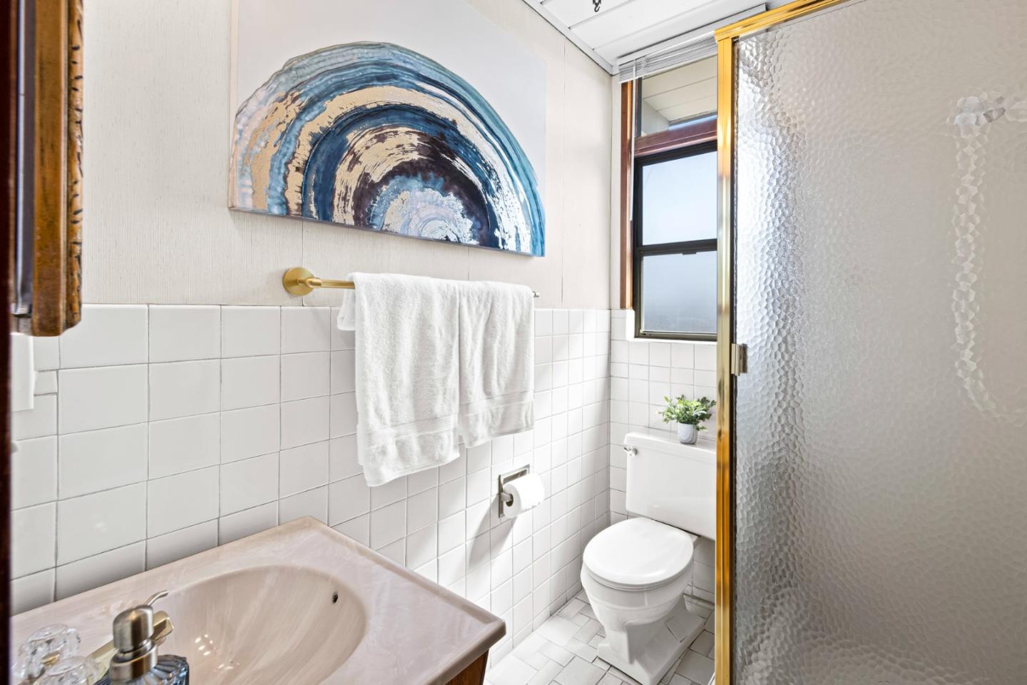 653 Edna Way San Mateo, CA 94402 - Photo 27 of 41 a bathroom with a toilet sink and mirror