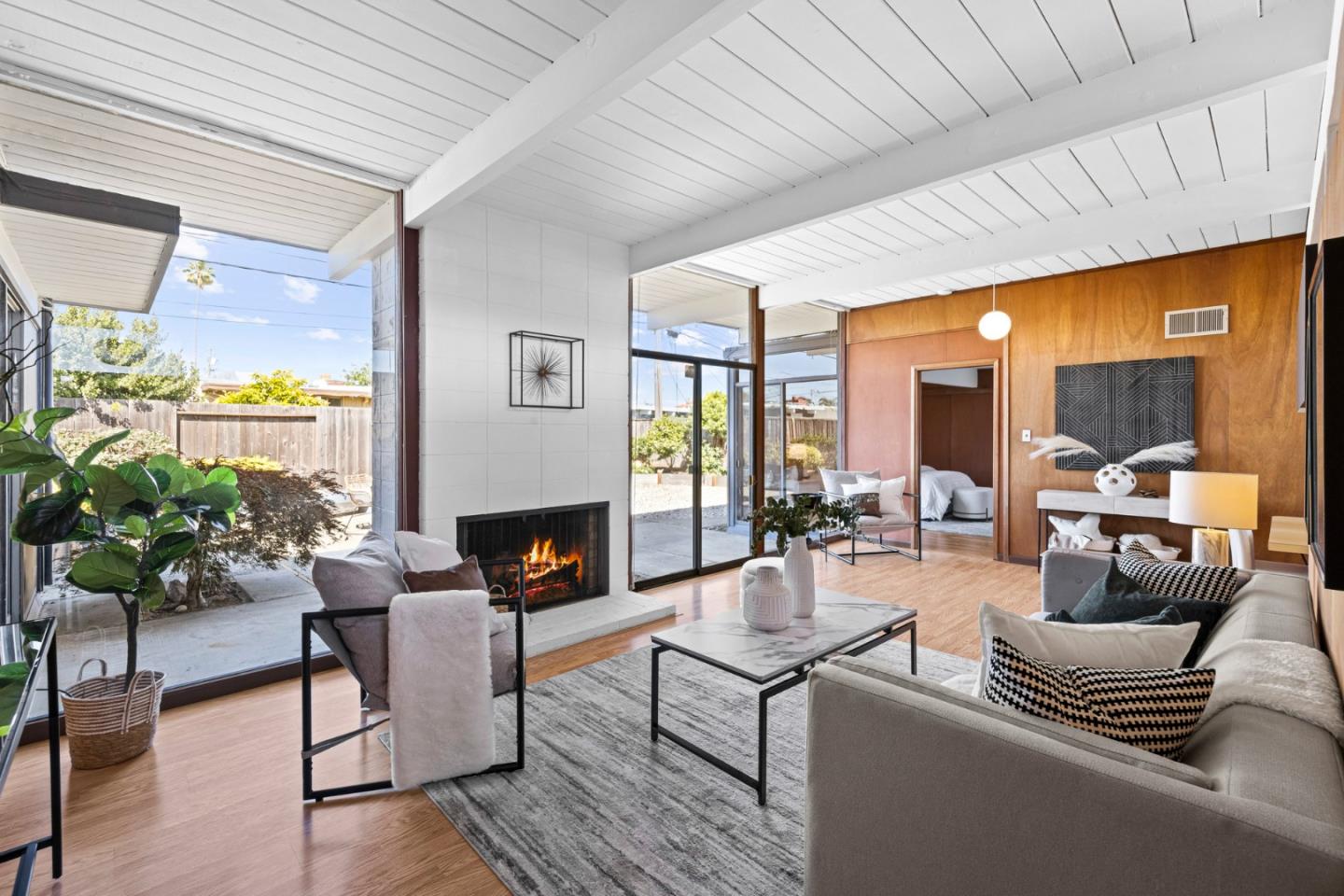 653 Edna Way San Mateo, CA 94402 - Photo 7 of 41 a living room with furniture fireplace and a large window