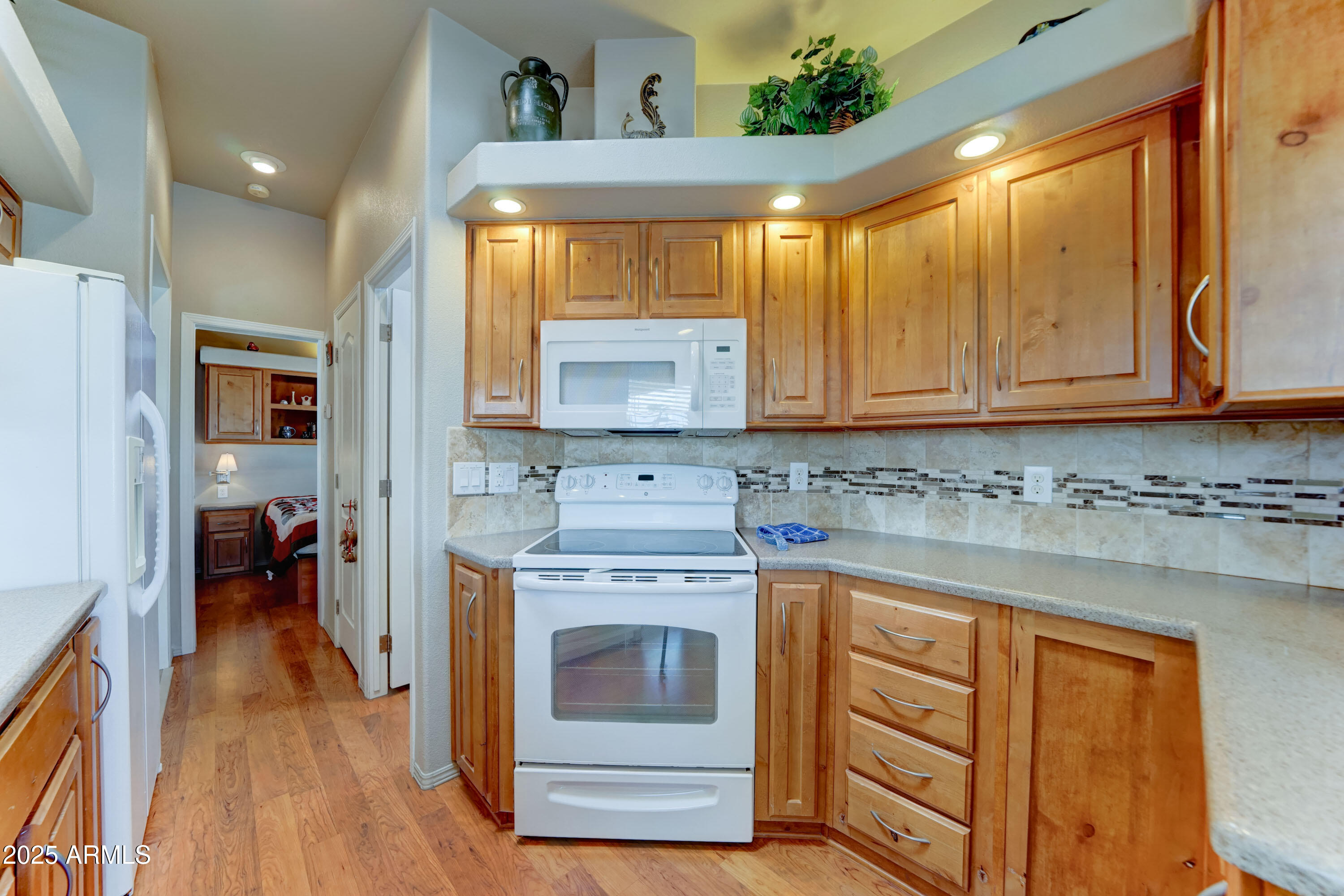 111 South Greenfield Road, Unit 166 Mesa, AZ 85206 - Photo 7 of 28 Cherry wood cabinets throughout the home