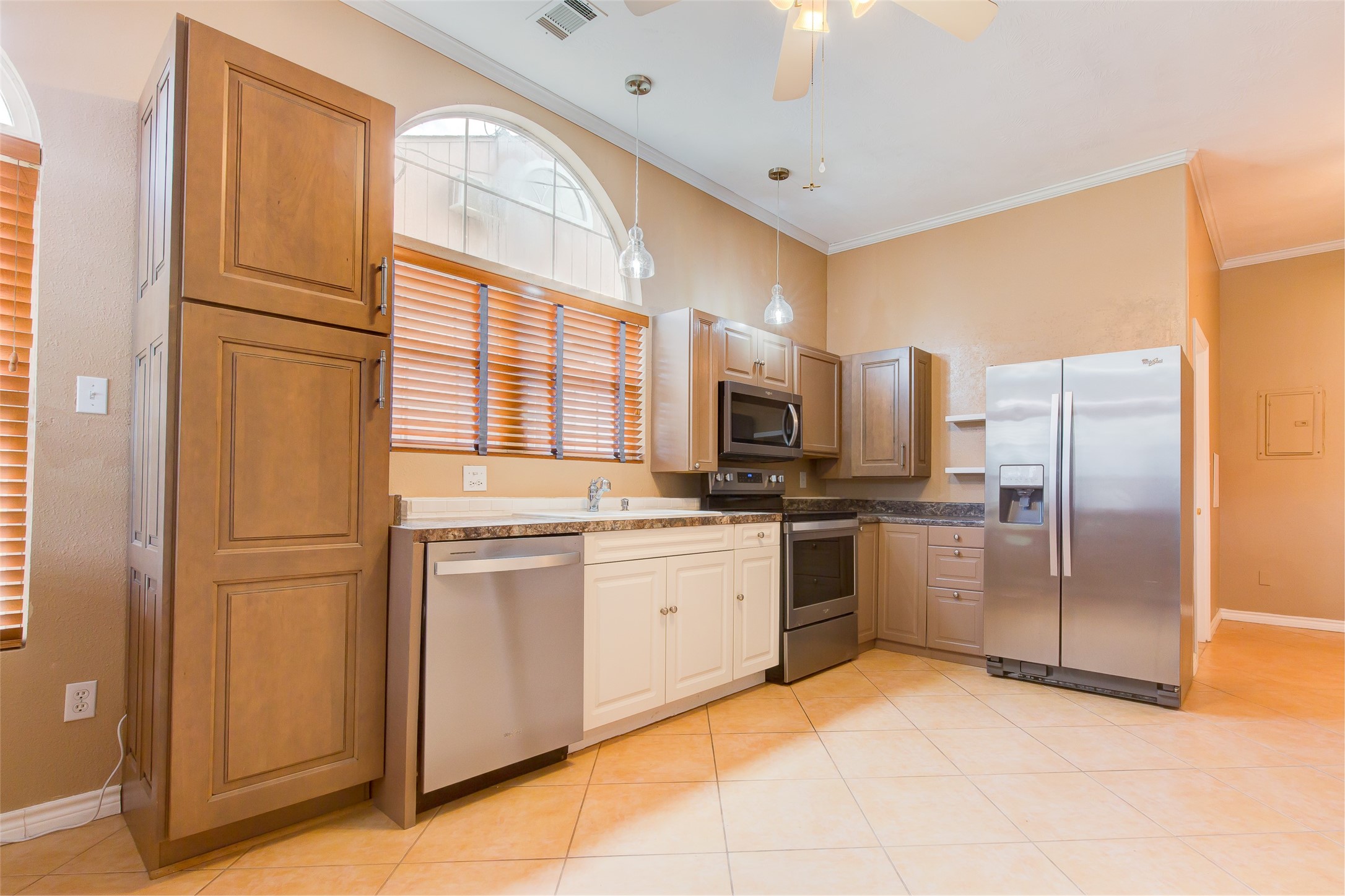 27014 Fm 2978 Magnolia, TX 77354 - Photo 5 of 15 a kitchen with stainless steel appliances granite countertop a refrigerator and a stove top oven
