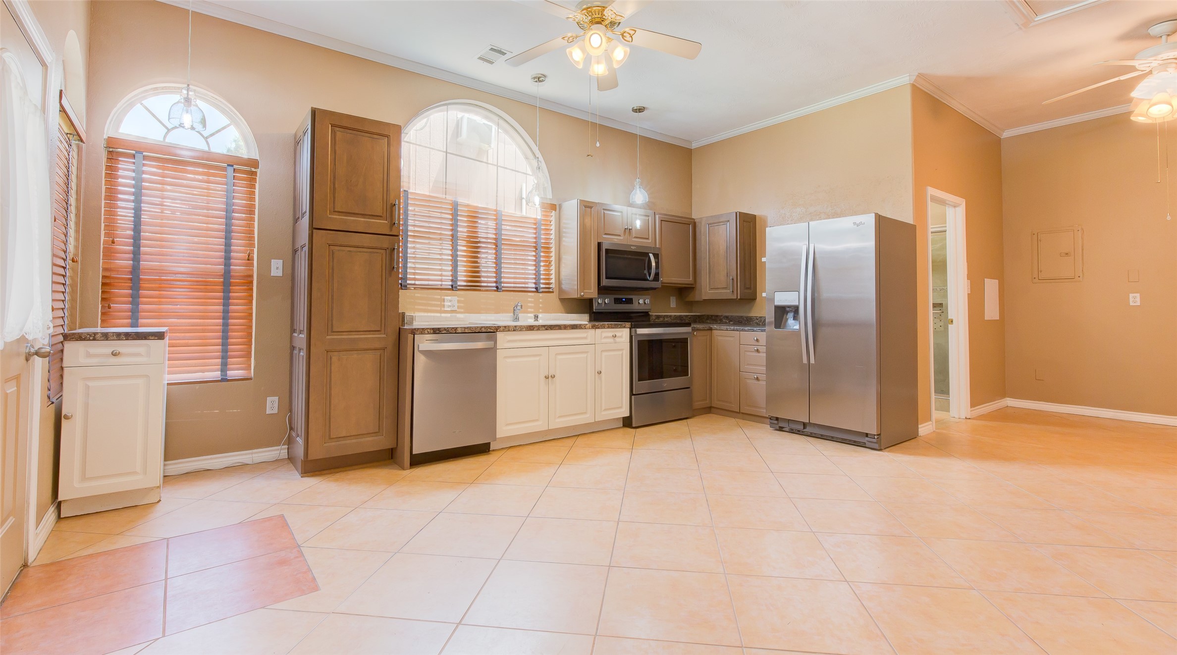 27014 Fm 2978 Magnolia, TX 77354 - Photo 6 of 15 a kitchen with stainless steel appliances granite countertop a stove top oven a refrigerator a sink and dishwasher