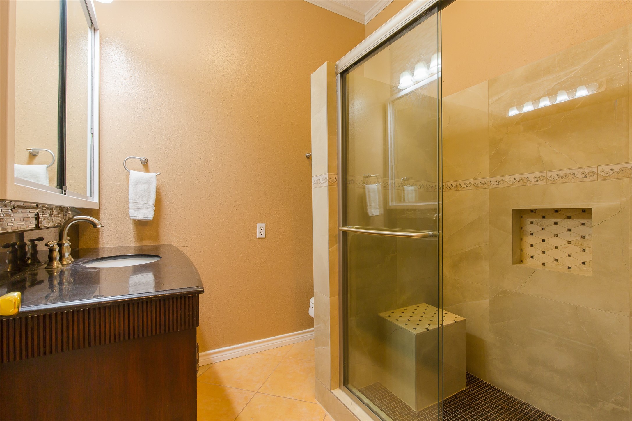 27014 Fm 2978 Magnolia, TX 77354 - Photo 9 of 15 a bathroom with a sink a mirror and a shower
