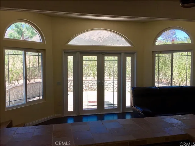 a living room with large windows