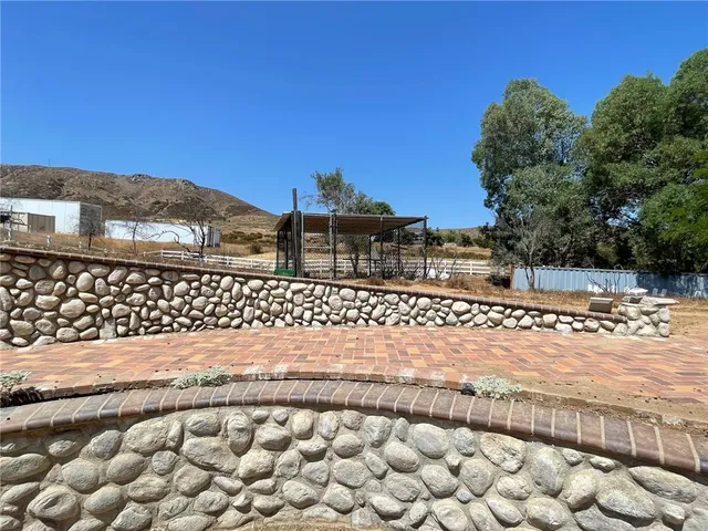 a view of a wooden fence next to a building