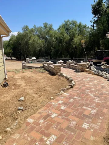 a view of swimming pool with sitting area