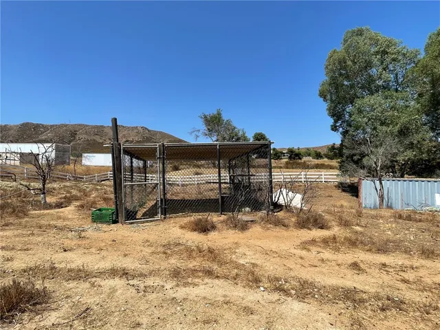 a view of a backyard of the house