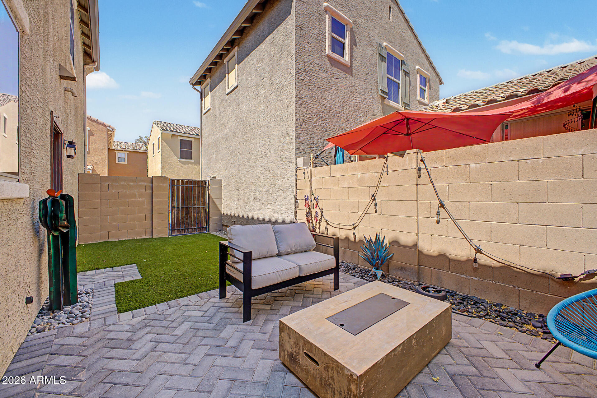 451 South Hawes Road, Unit 27 Mesa, AZ 85208 - Photo 26 of 27 a view of a patio with couches and a table and chairs