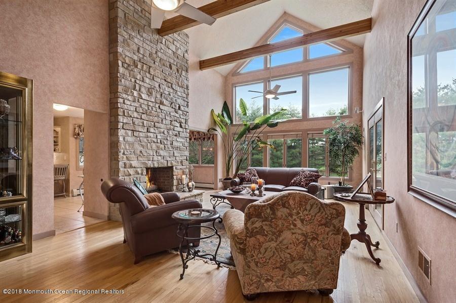 148 Emley's Hill Road Cream Ridge, NJ 08514 - Photo 3 of 27 a living room with furniture and a floor to ceiling window