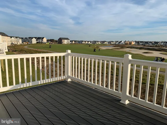 a view of a balcony with wooden floor
