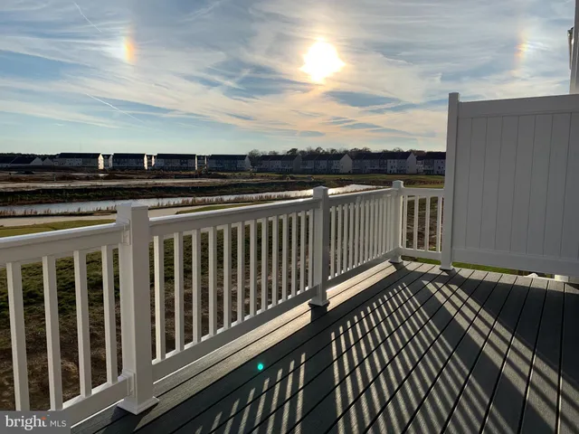 a view of a balcony with wooden floor
