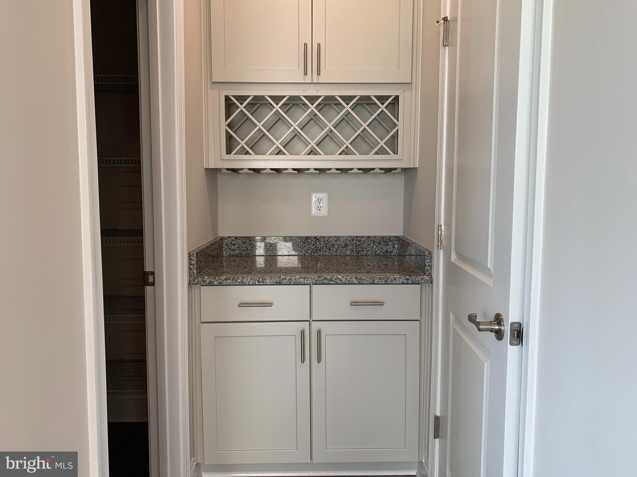 35318 Wright Way Millsboro, DE 19966 - Photo 15 of 28 a bathroom with a granite countertop sink and washing machine