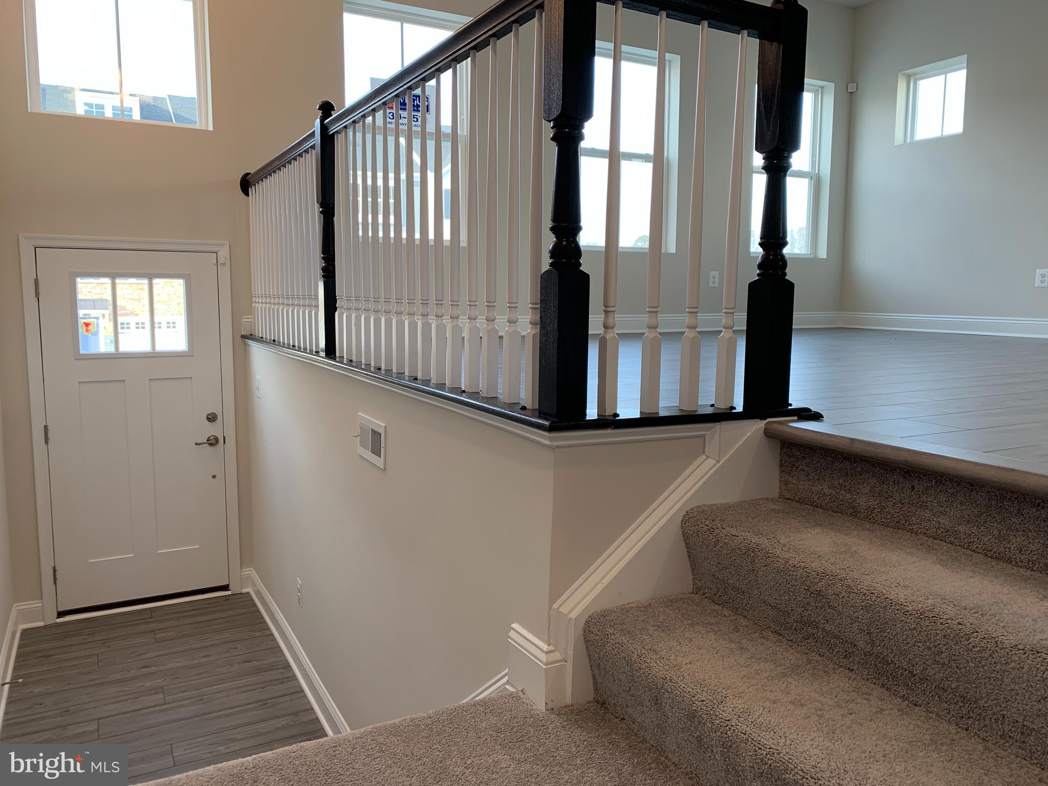 35318 Wright Way Millsboro, DE 19966 - Photo 3 of 28 a view of entryway and hall with wooden floor