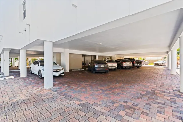 a living room with furniture and a cars park
