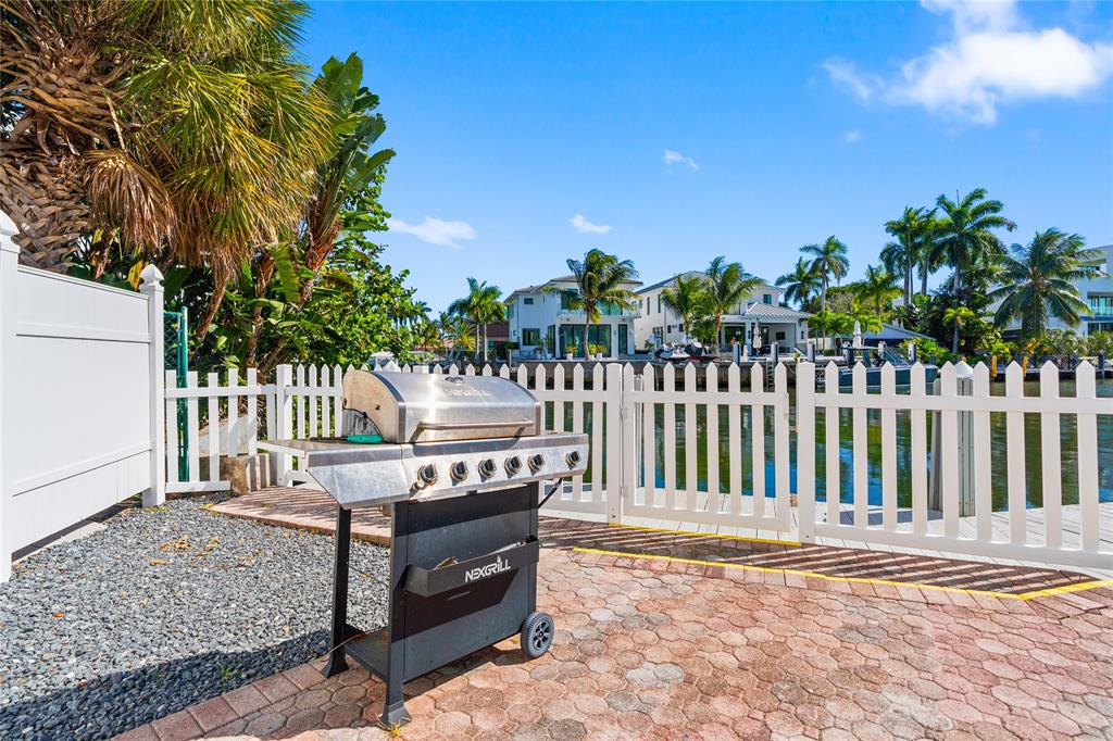 1770 East Las Olas Boulevard, Unit 505 Fort Lauderdale, FL 33301 - Photo 13 of 33 a view of a wooden bench and chair in the patio
