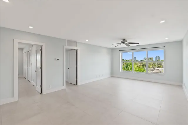 a view of an empty room and a window