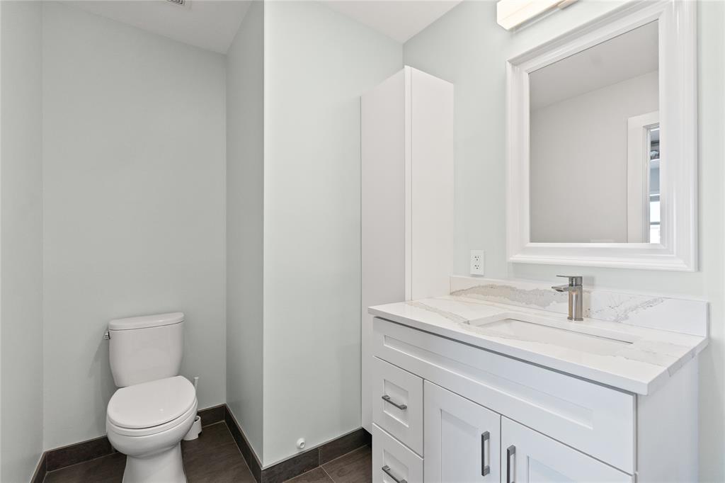1770 East Las Olas Boulevard, Unit 505 Fort Lauderdale, FL 33301 - Photo 23 of 33 a bathroom with a toilet sink and mirror