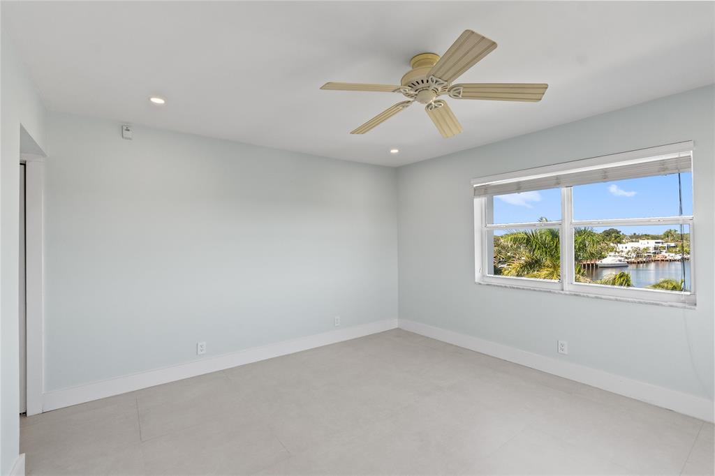 1770 East Las Olas Boulevard, Unit 505 Fort Lauderdale, FL 33301 - Photo 25 of 33 an empty room with windows and fan