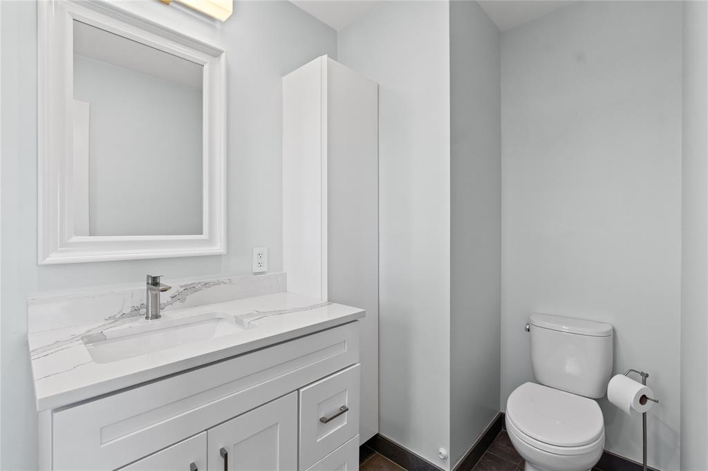 1770 East Las Olas Boulevard, Unit 505 Fort Lauderdale, FL 33301 - Photo 26 of 33 a bathroom with a toilet a sink and mirror