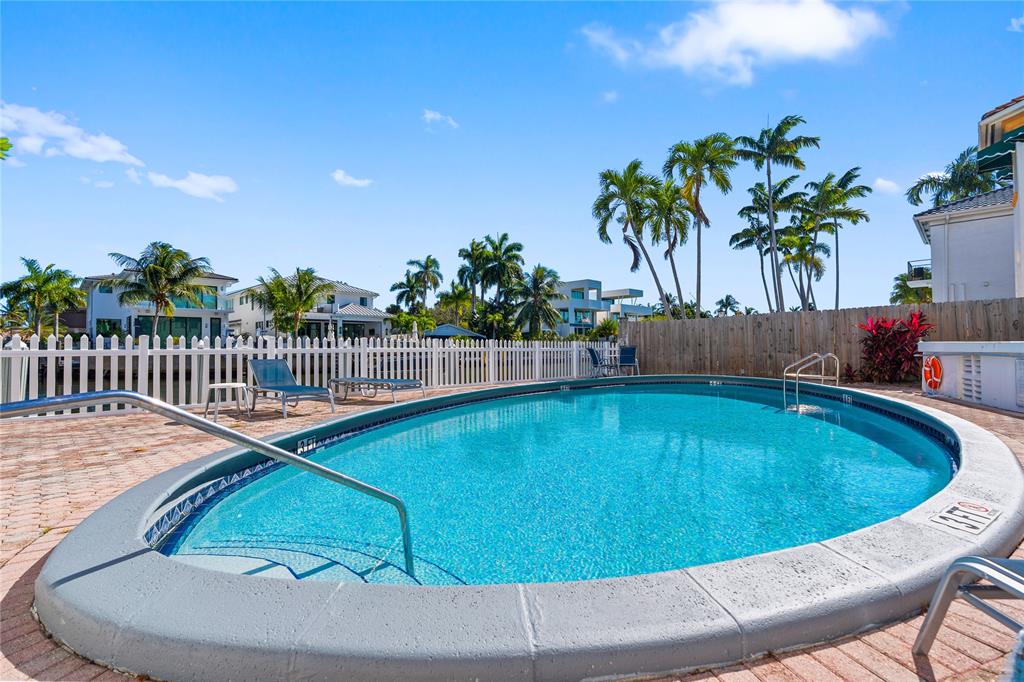 1770 East Las Olas Boulevard, Unit 505 Fort Lauderdale, FL 33301 - Photo 8 of 33 a view of a swimming pool with a lounge chair