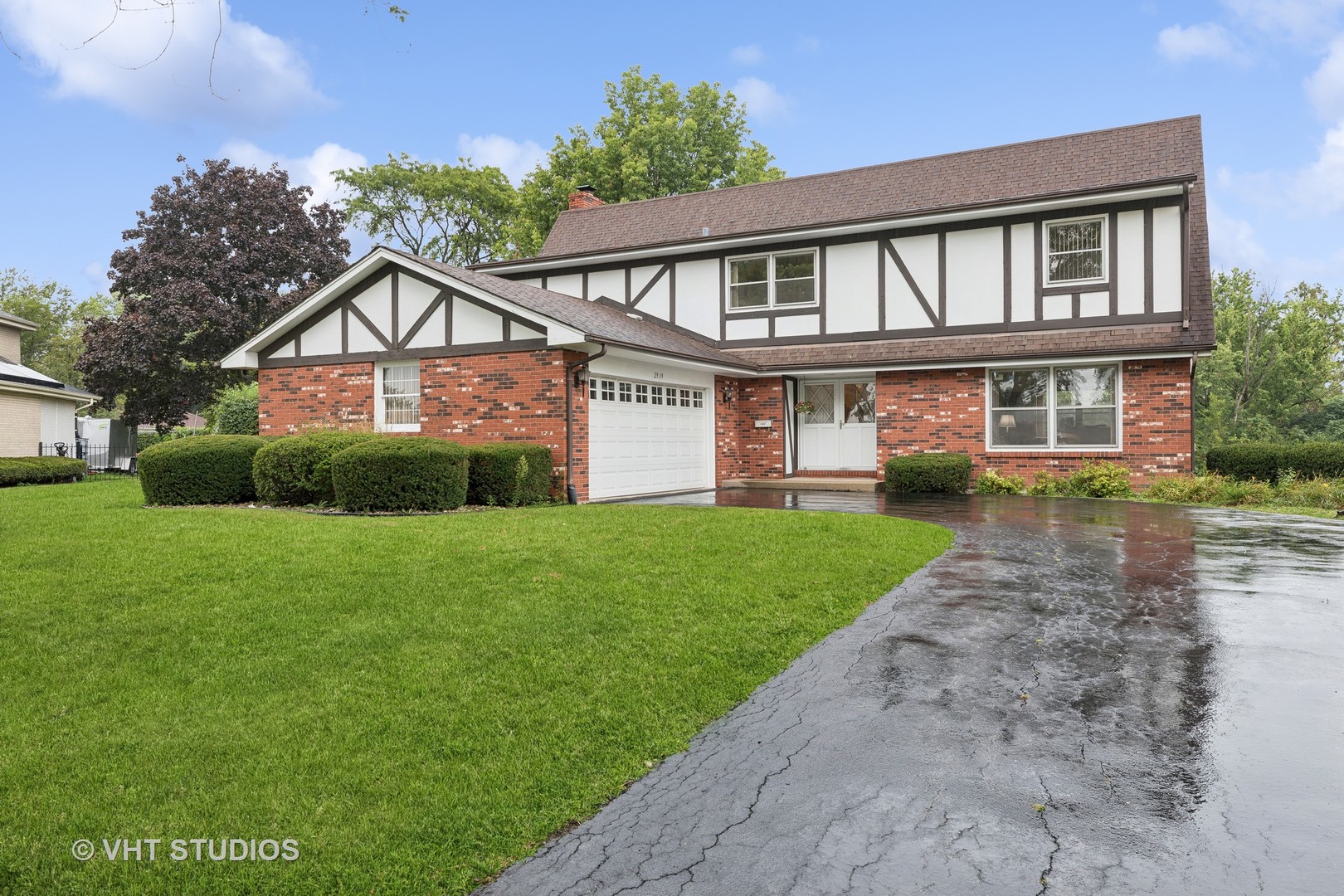 2919 Embassy Row Flossmoor, IL 60422 - Photo 1 of 20 a front view of a house with a yard and potted plants