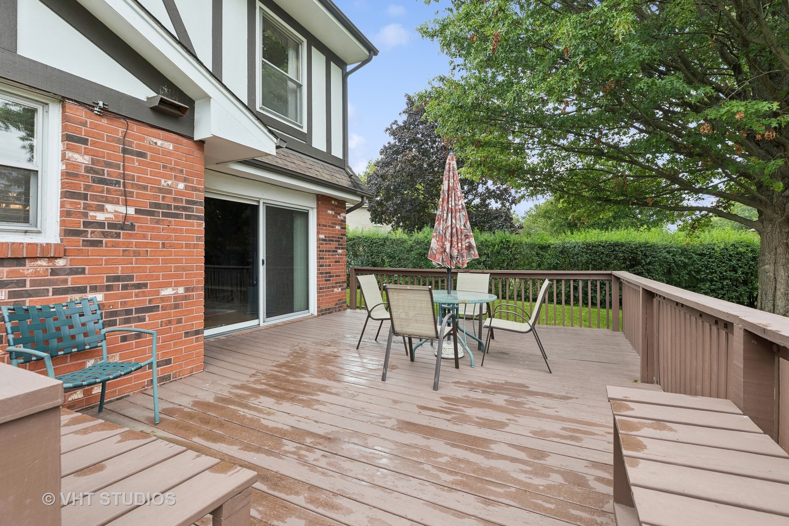 2919 Embassy Row Flossmoor, IL 60422 - Photo 18 of 20 a view of a roof deck with table and chairs floor to ceiling window with wooden floor