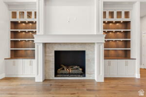 1141 East Lost Ridge Drive Washington, UT 84780 - Photo 28 of 108 Gas fireplace with a stone surround and a substantial white mantelpiece