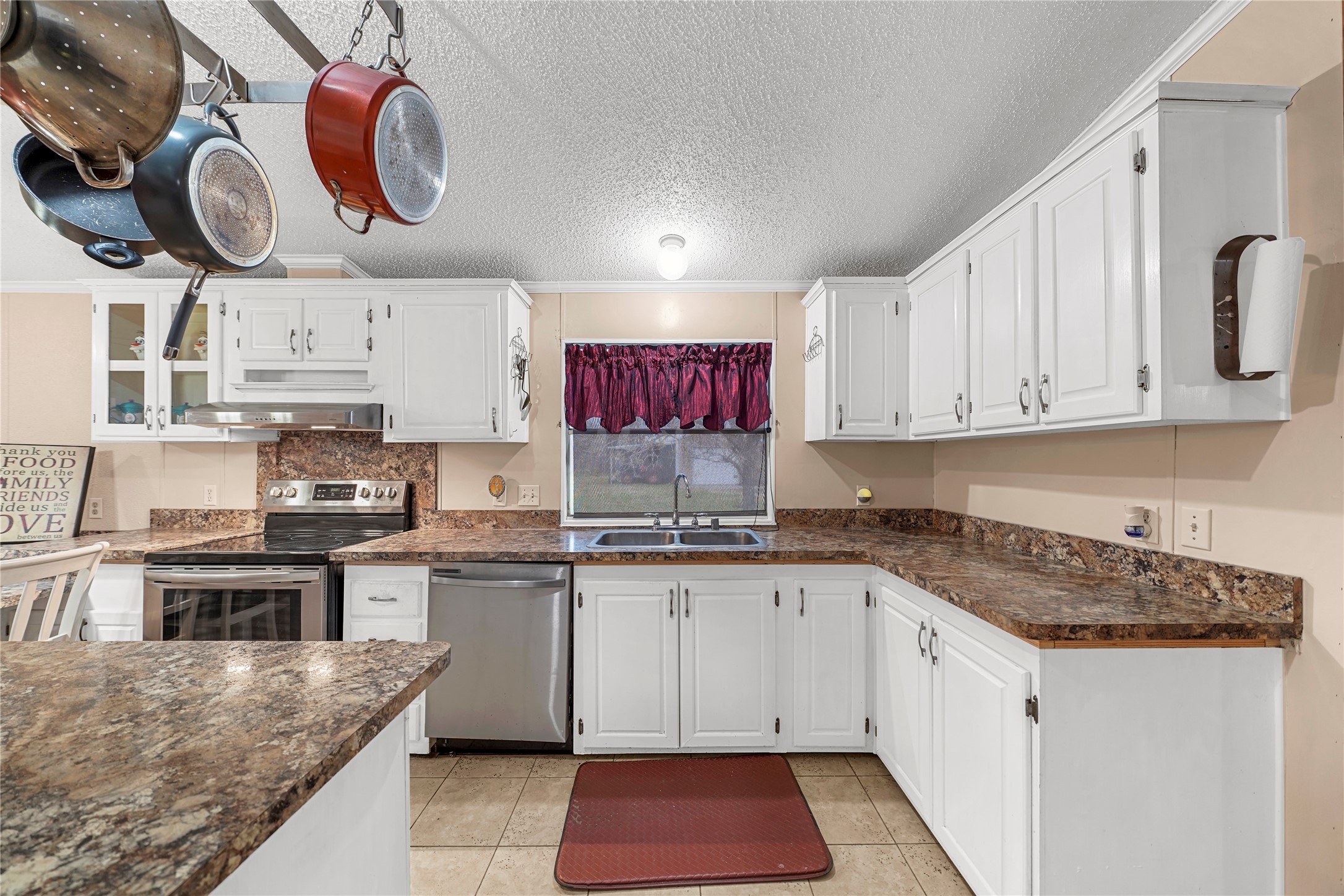 19645 Nordt Road Damon, TX 77430 - Photo 11 of 50 a kitchen with cabinets and window