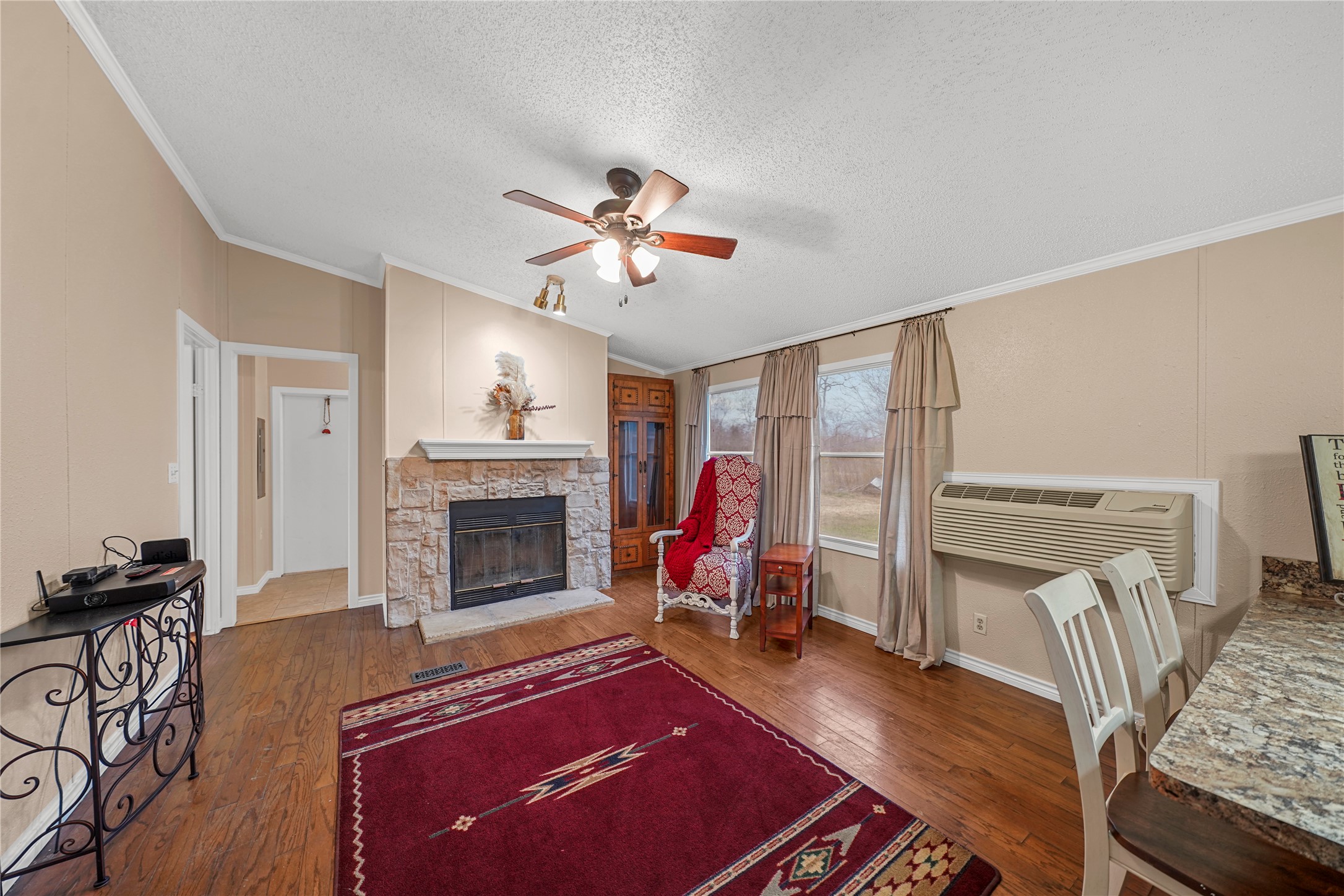 19645 Nordt Road Damon, TX 77430 - Photo 14 of 50 a living room with furniture and a fireplace