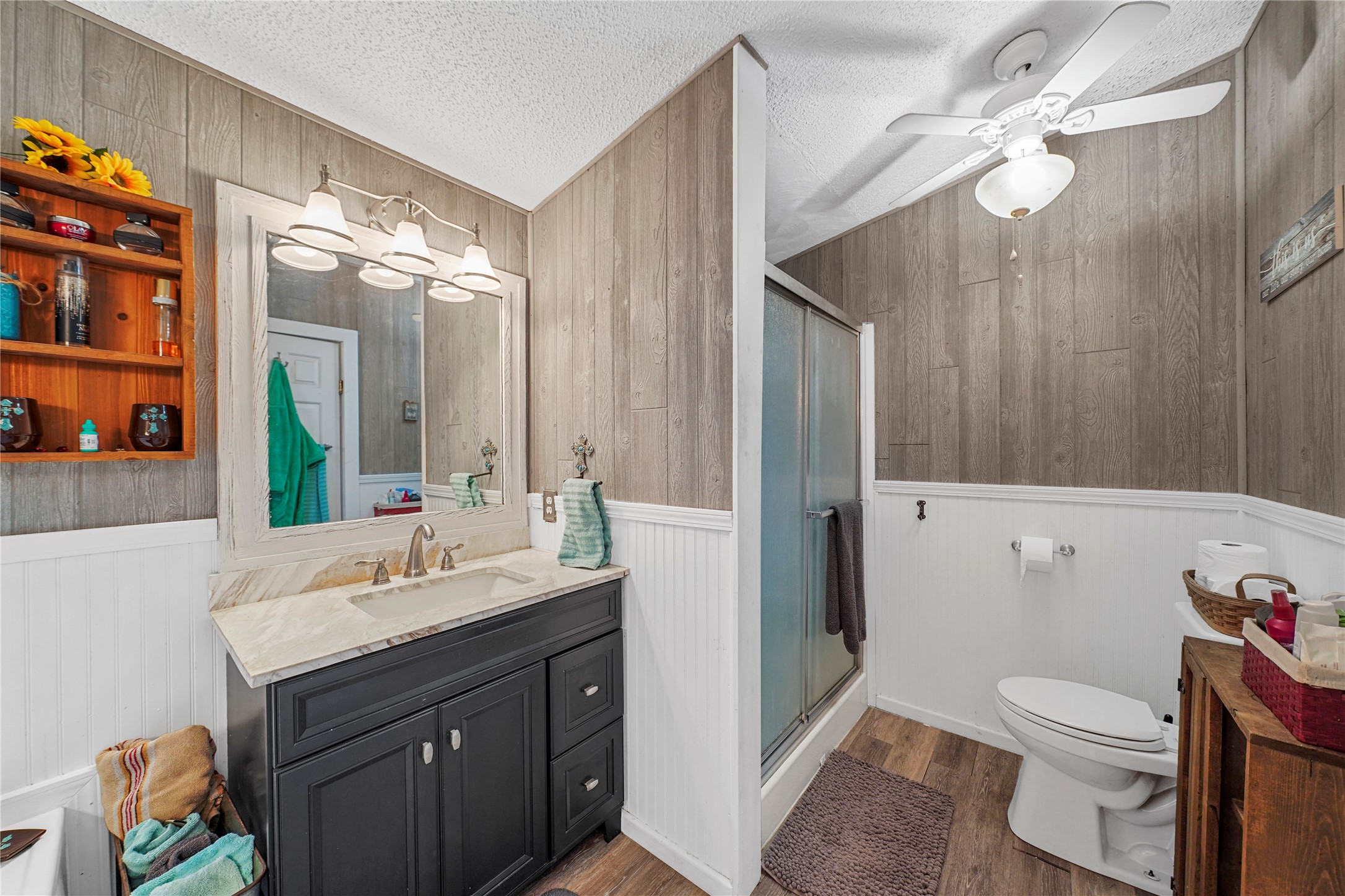 19645 Nordt Road Damon, TX 77430 - Photo 18 of 50 a bathroom with a sink vanity mirror and toilet