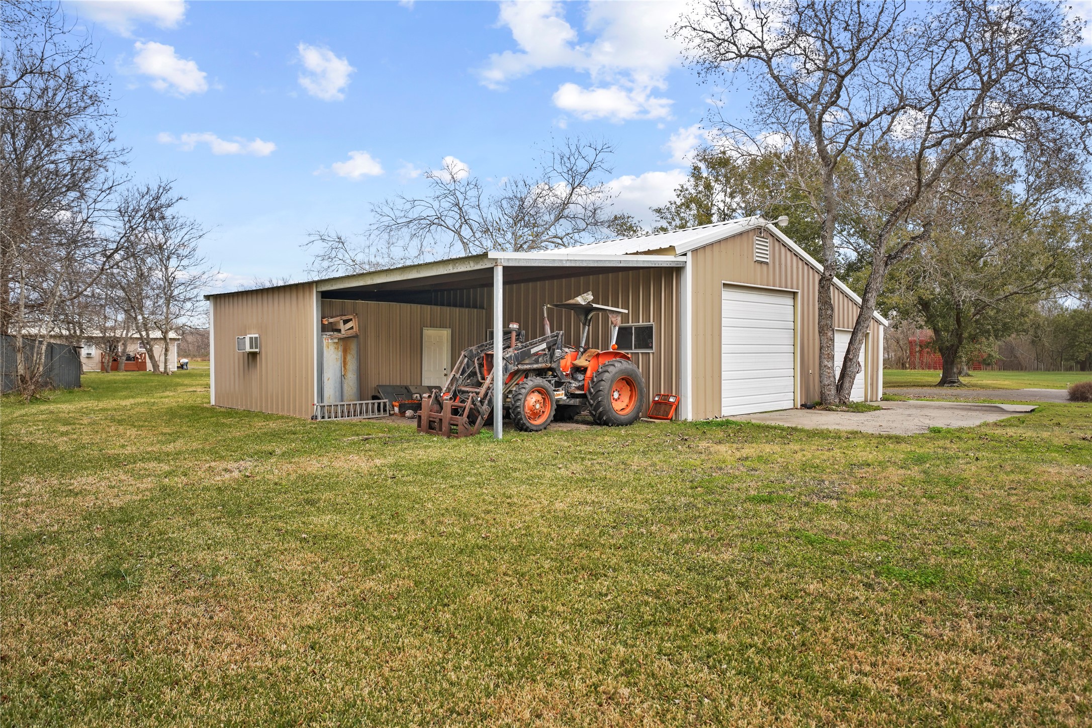 19645 Nordt Road Damon, TX 77430 - Photo 26 of 50 a view of a backyard with a garden and trees