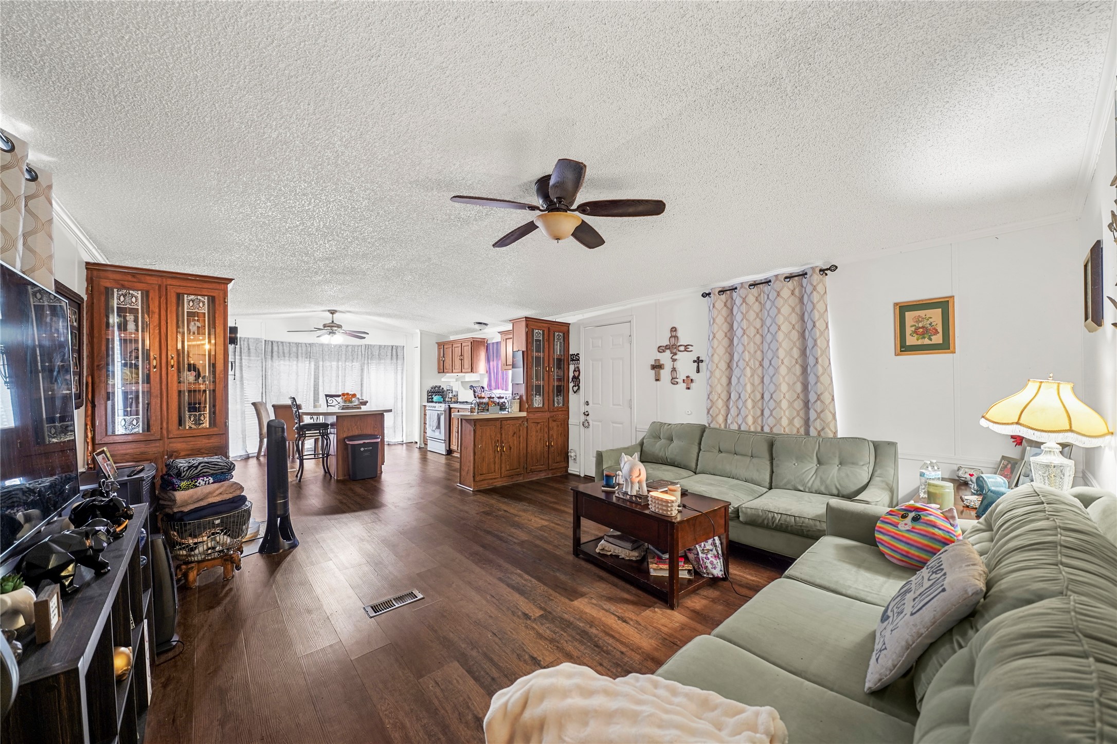 19645 Nordt Road Damon, TX 77430 - Photo 30 of 50 a living room with furniture kitchen view and a wooden floor